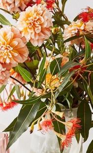 Artificial Golden Hour Flowers in Vase offers in Kmart