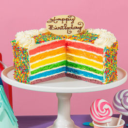 A RAINBOW CAKE offers at $67.95 in The Cheesecake Shop