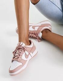 Nike Dunk Low trainers in white and rose whisper offers at $99.95 in Topshop
